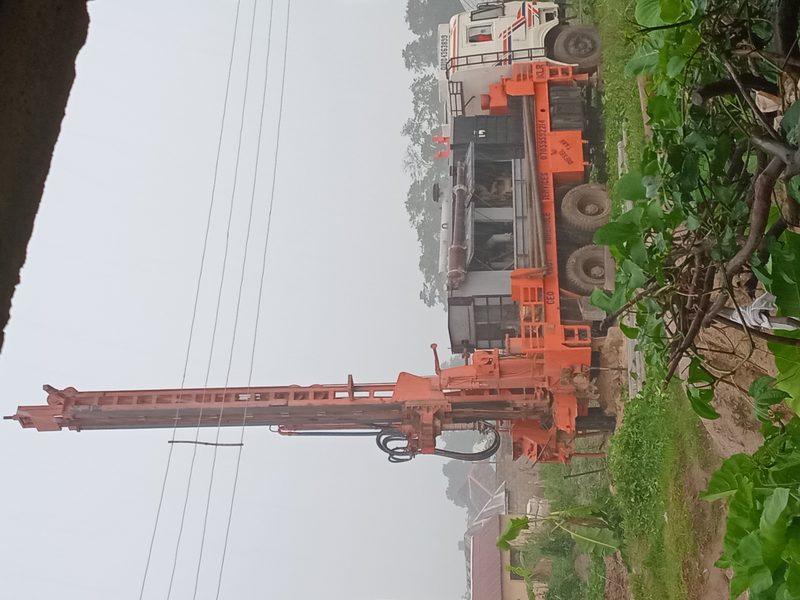 Orange drilling rig in action